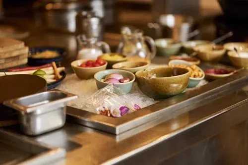 Prep station with portioned bowls of fresh ingredients ready for the week ahead